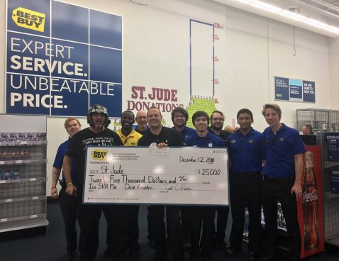 Posing with a check for St. Jude at a Best Buy near Seattle.