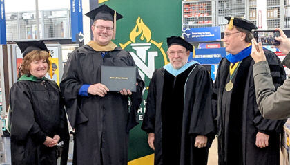 A Michigan blue shirt worked so his colleagues could walk at their commencement.
