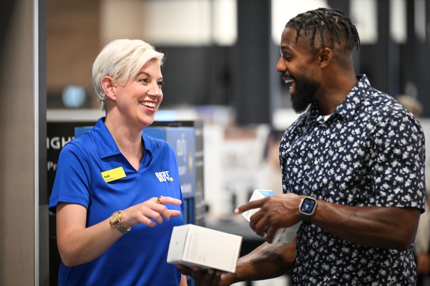 Best Buy employee and customer interacting