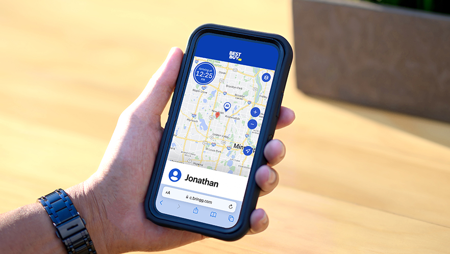 A person showing their phone screen with the live-tracking app map